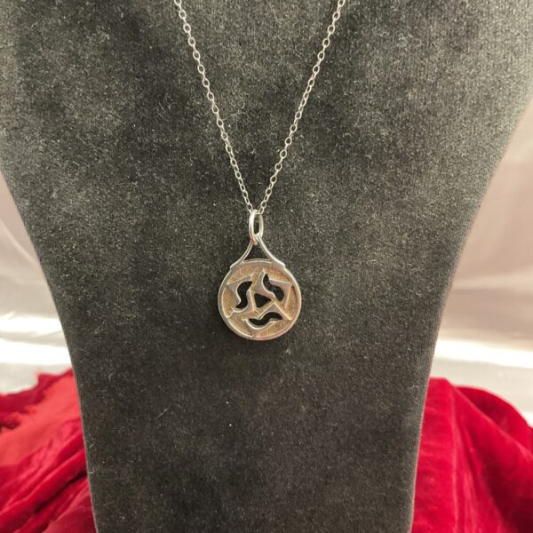 Silver Celtic pendant necklace with intricate knotwork design.