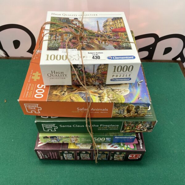 Mixed lot of jigsaw puzzles including Ravensburger and Clementoni brands.