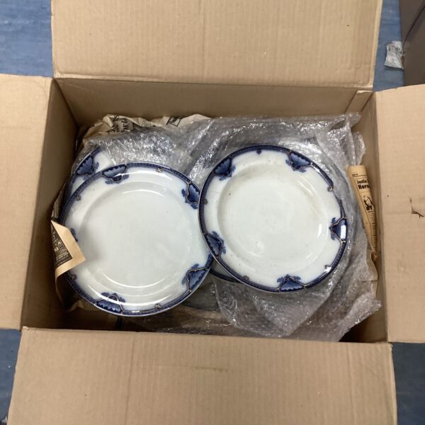 Vintage Burslem dinner plates with floral design and gilded rims.