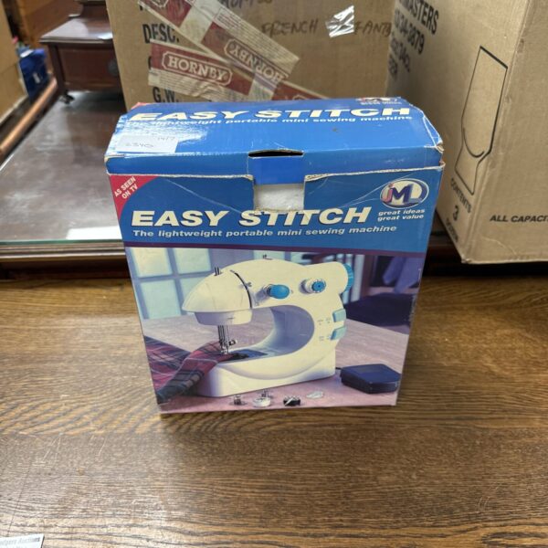 Vintage Easy Stitch mini sewing machine, portable and compact.