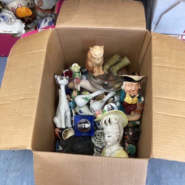 Mixed lot of vintage ornaments including Toby Jugs and table lighters.