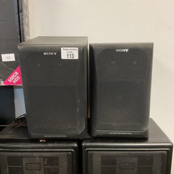 Vintage Sony base reflex speakers in black cabinet.