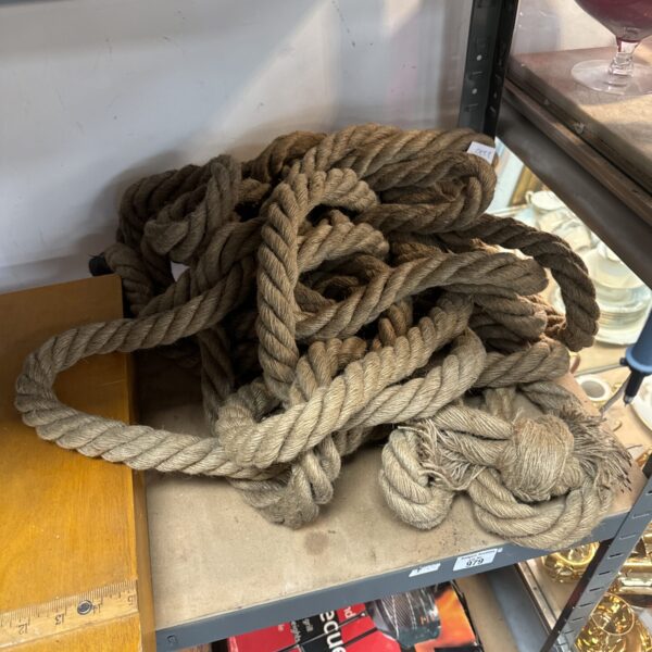 Coiled thick rope, ideal for nautical or garden projects.