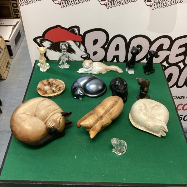 Vintage ceramic cat ornaments and door stops collection.