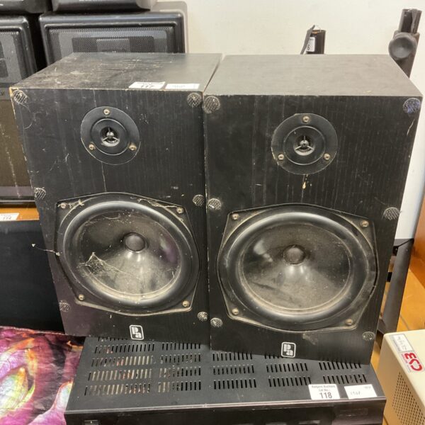 Pair of vintage bookshelf speakers with dark wood finish.