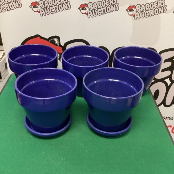 Five blue glazed ceramic garden pots displayed outdoors.