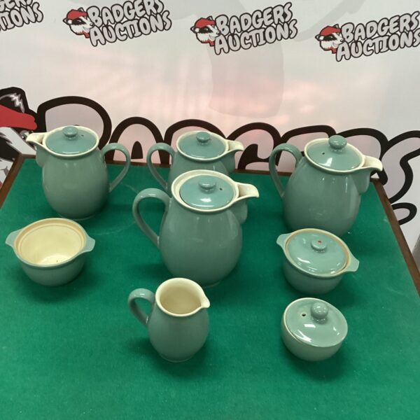Vintage Denby Pottery teapots and stoneware collection on display.