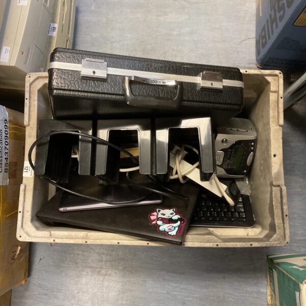 Lot of used laptops and electronic accessories for repair or parts.