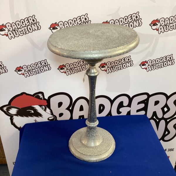 Vintage metal pot stand with tripod legs.