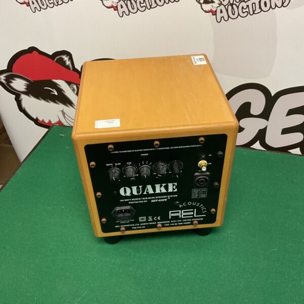 Front view of a vintage Quake base box amplifier.