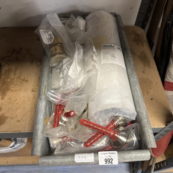 Tray of mixed brass and metal engineering fittings for workshop use.