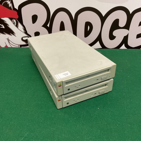 Front view of a vintage Apple CD Caddy SCSI CD-ROM drive.
