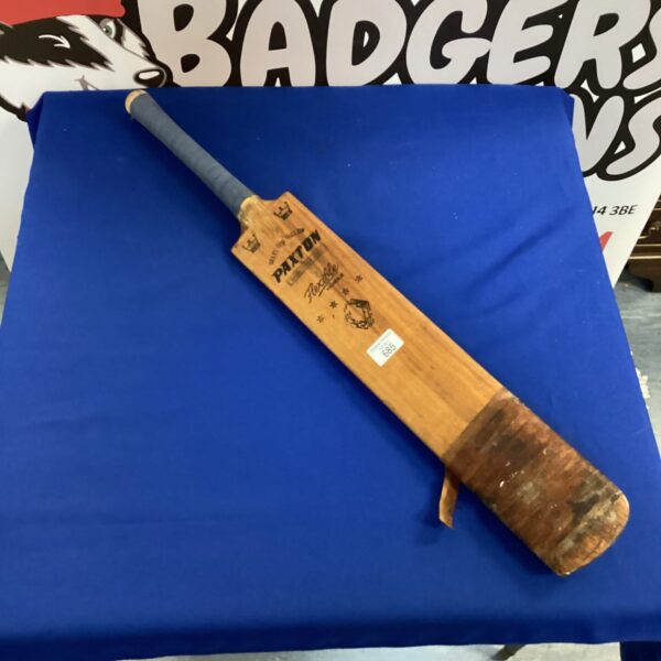 Vintage willow cricket bat for sports and collecting.