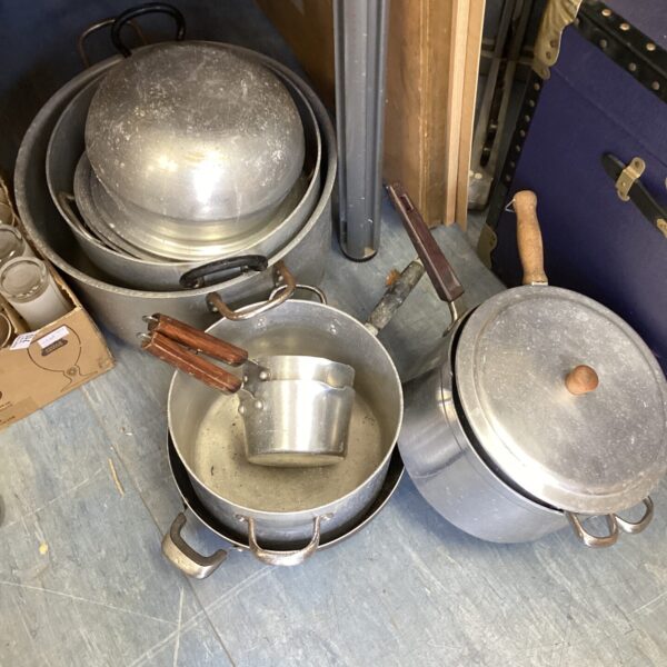 Lot of large stainless steel catering cooking pans.