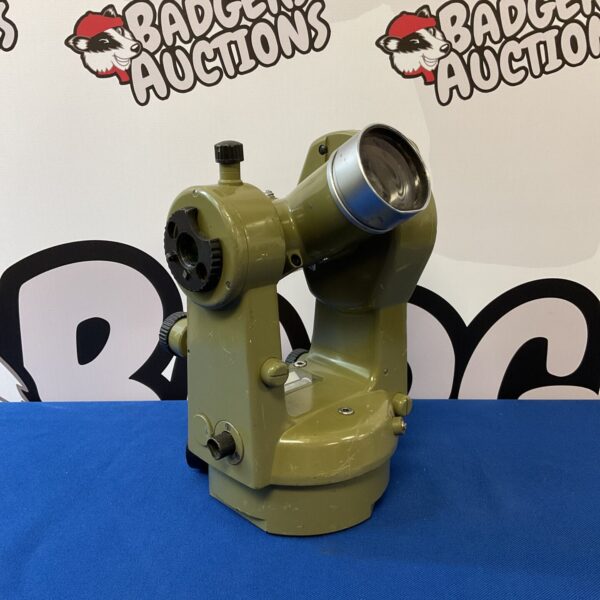 Vintage Kern theodolite surveying instrument with level and telescope.