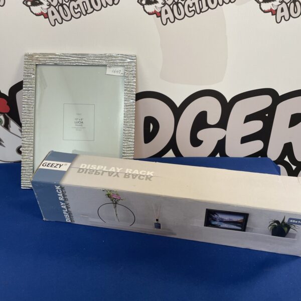 Vintage Geezy display rack with 10x8 picture frame for display.