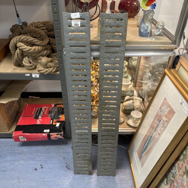 Galvanised metal drainage gully covers for outdoor use.