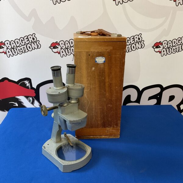 Vintage Charles Perry microscope, a classic scientific instrument.