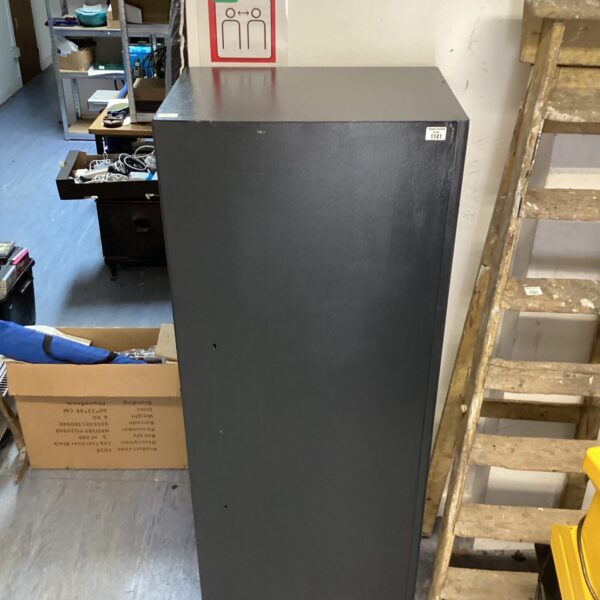 Large metal gun cabinet with keys, front view.