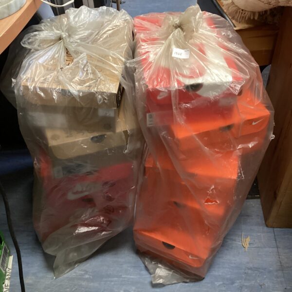 Lot of ten vintage orange Nike trainer boxes for collectors.
