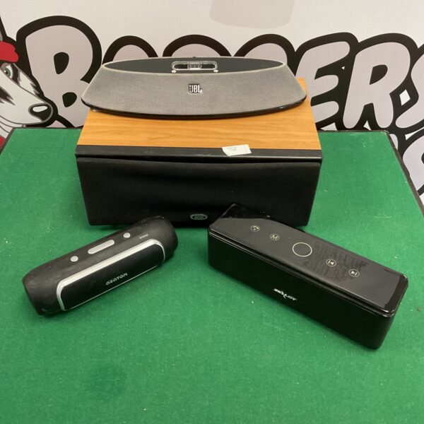 Black JBL speaker system with central unit and satellite speakers.