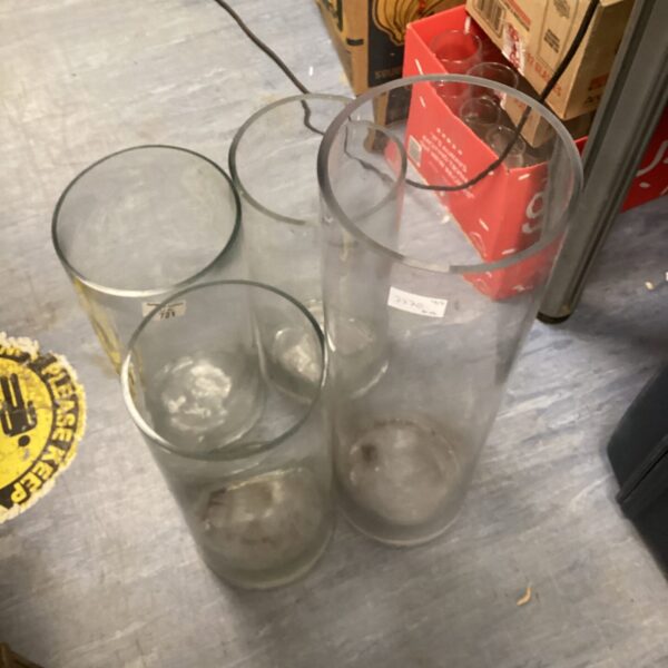 Clear tall glass vases for floral displays and home decor.