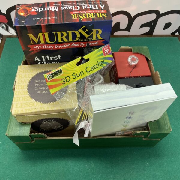 Mixed lot featuring a murder mystery game, candle, and money bank.