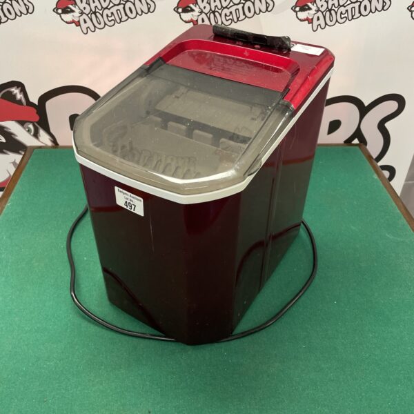 Front view of a used electric ice maker appliance.