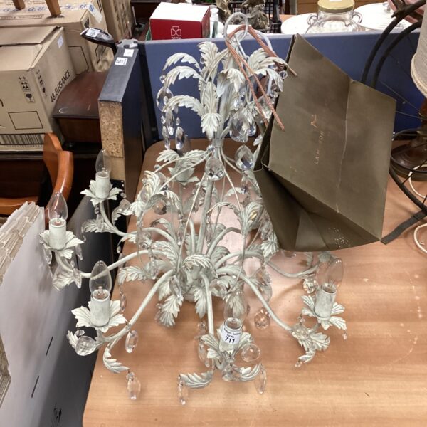 Vintage crystal chandelier with brass frame and crystal drops.