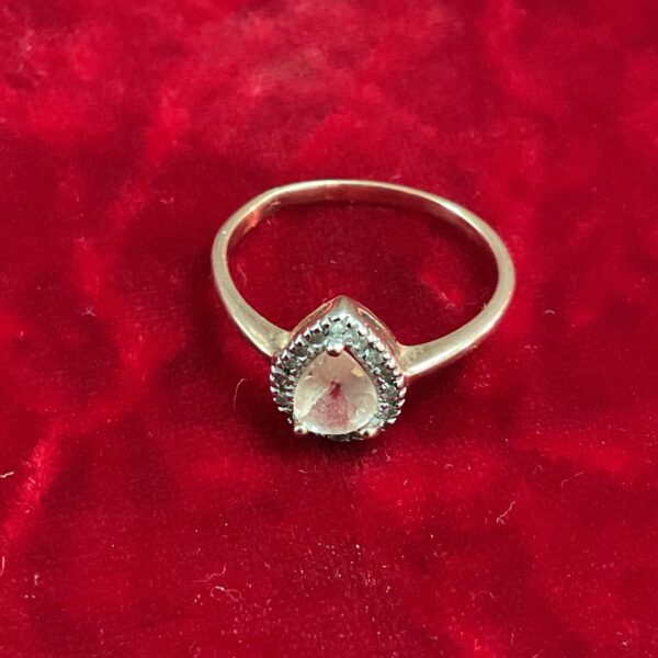 Elegant 9ct gold ring with a teardrop stone setting.