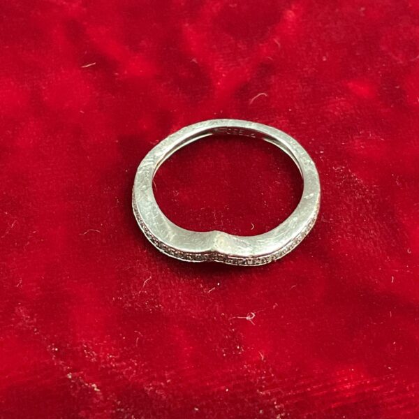 Platinum and diamond wishbone ring, size I, showcasing delicate design.