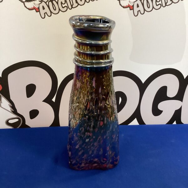 Vibrant Murano glass vase with swirling blue and purple patterns.