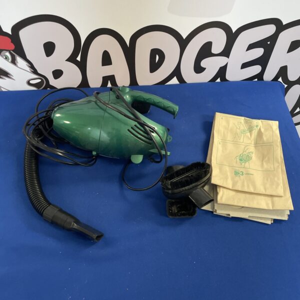 Vintage Coopers handheld vacuum cleaner in bright green.