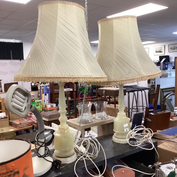 Pair of vintage alabaster lamps with cream shades.