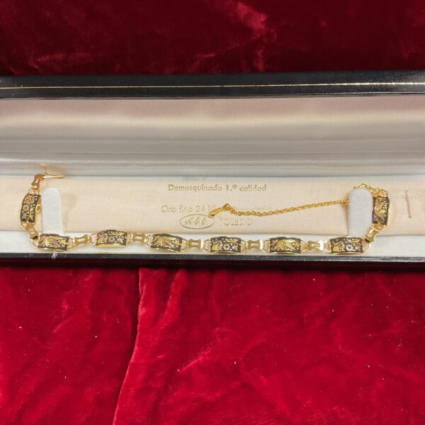Intricate gold plated Toledo bracelet with filigree detailing.