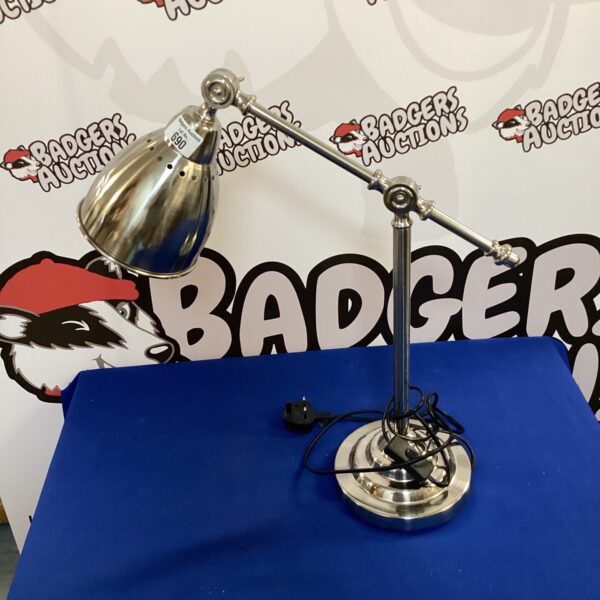 Modern stainless steel desk lamp with adjustable arm.