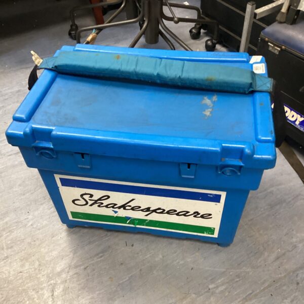 Blue vintage Shakespeare fishing tackle box with handle.