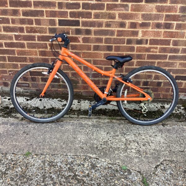 Side view of a used Carrera Abyss mountain bike.