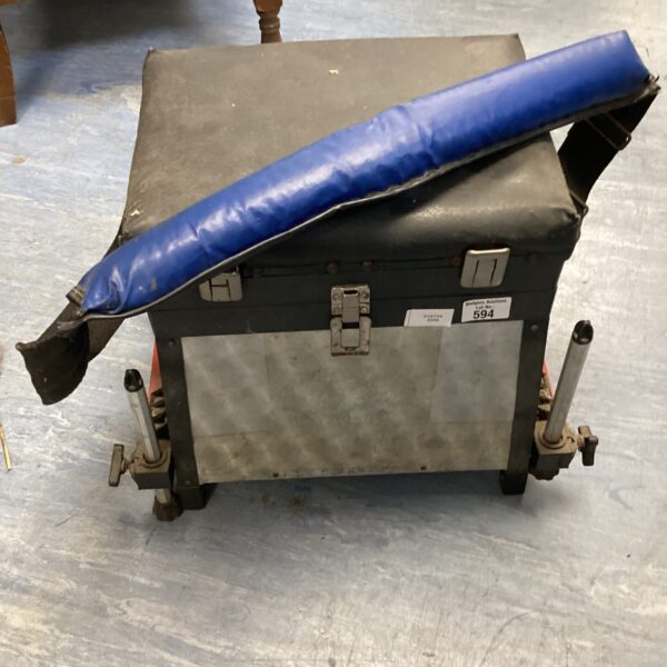 Vintage seated fishing tackle box with blue padded seat.