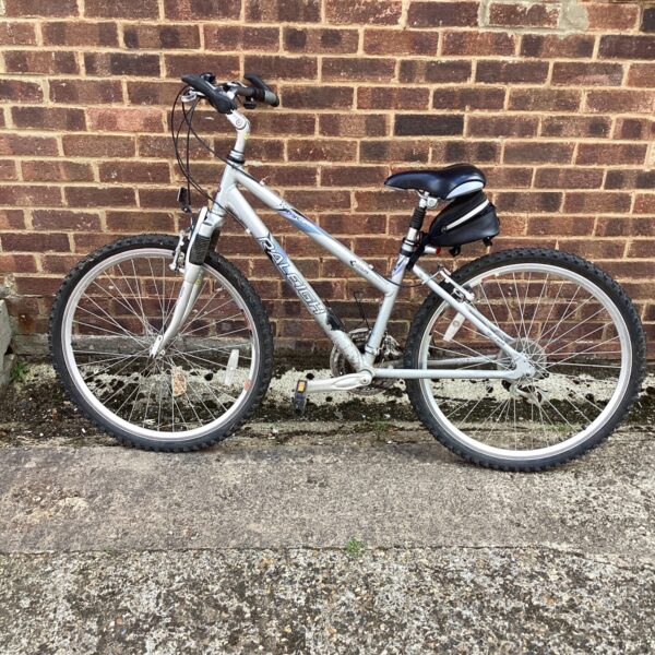 Side view of a used Raleigh Voyager mountain bike.