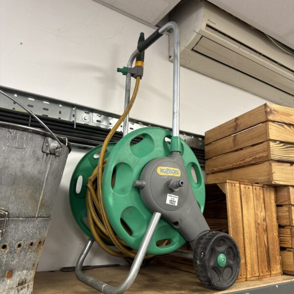 Vintage Hozelock hose reel for garden watering.
