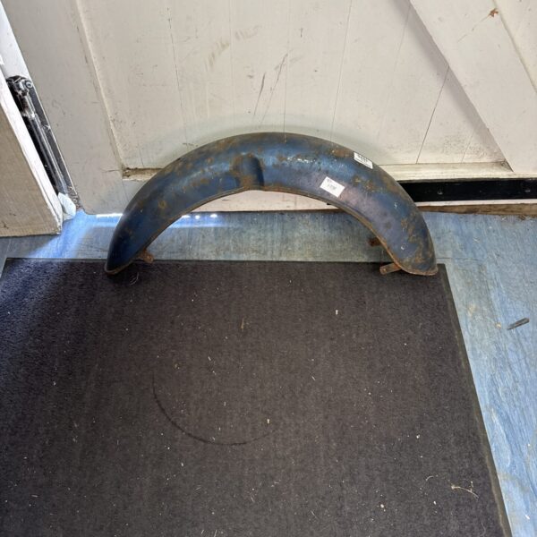 Vintage motorcycle front mudguard showing signs of age.