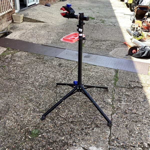Black adjustable bike work stand for bicycle repair and maintenance.