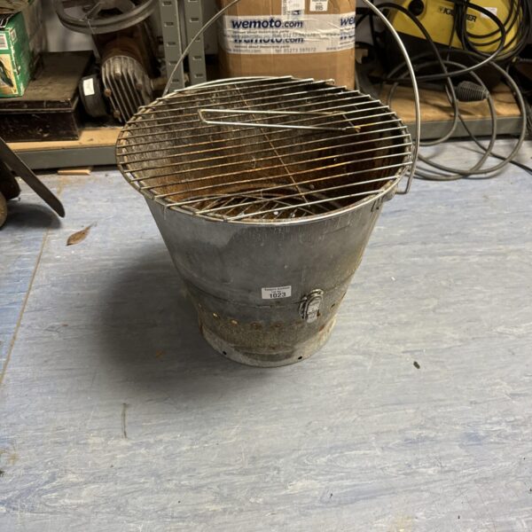 Vintage portable bucket barbecue with wire mesh grill.