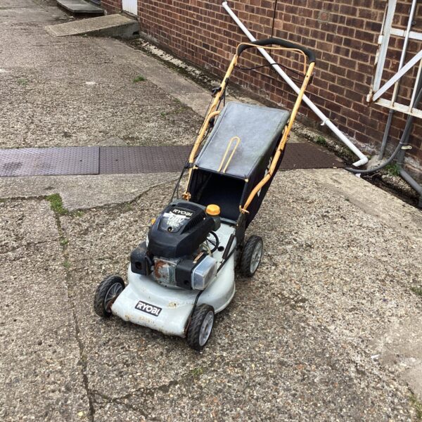 Used Ryobi lawn mower for garden maintenance and trimming.