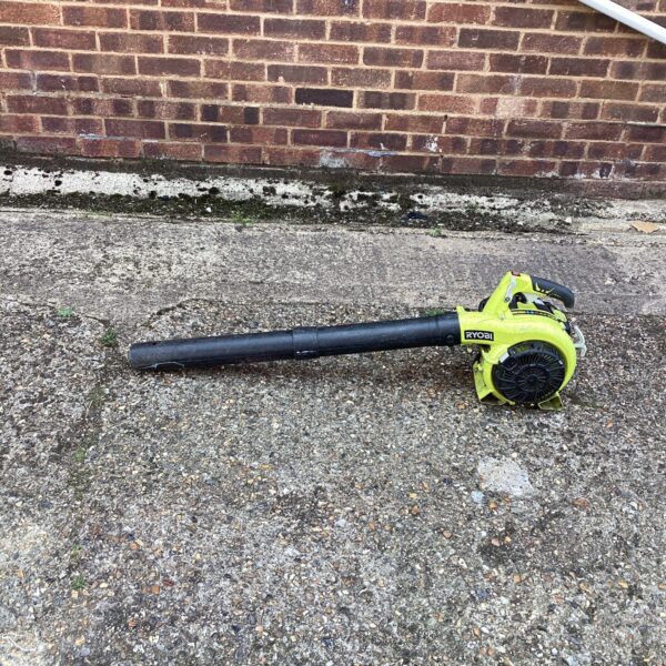 Used Ryobi petrol leaf blower for garden maintenance.