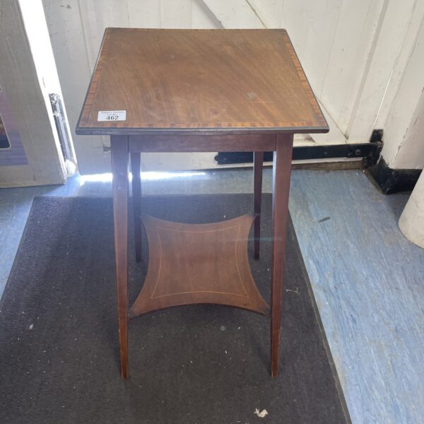 Antique mahogany occasional table with inlaid banding detail.