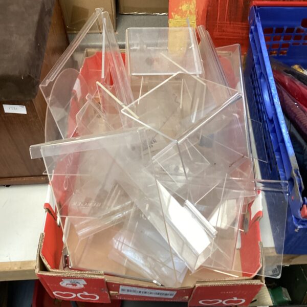 Lot of clear acrylic display stands for retail or collectibles.