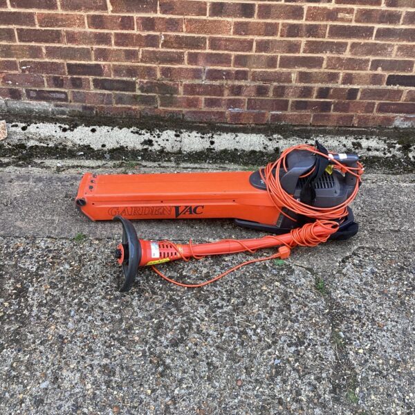 Orange Flymo garden vac with collection bag.