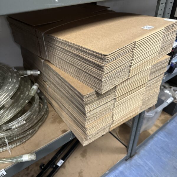 Stack of flat-packed cardboard boxes ready for moving or storage.